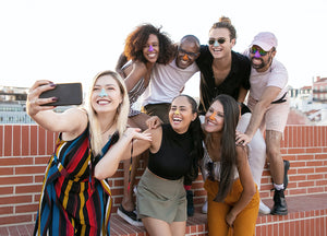 Group taking a cute picture while wearing Nöz sunscreen.