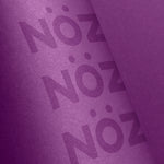 Load image into Gallery viewer, Close up view of Nöz sunscreen stick in purple
