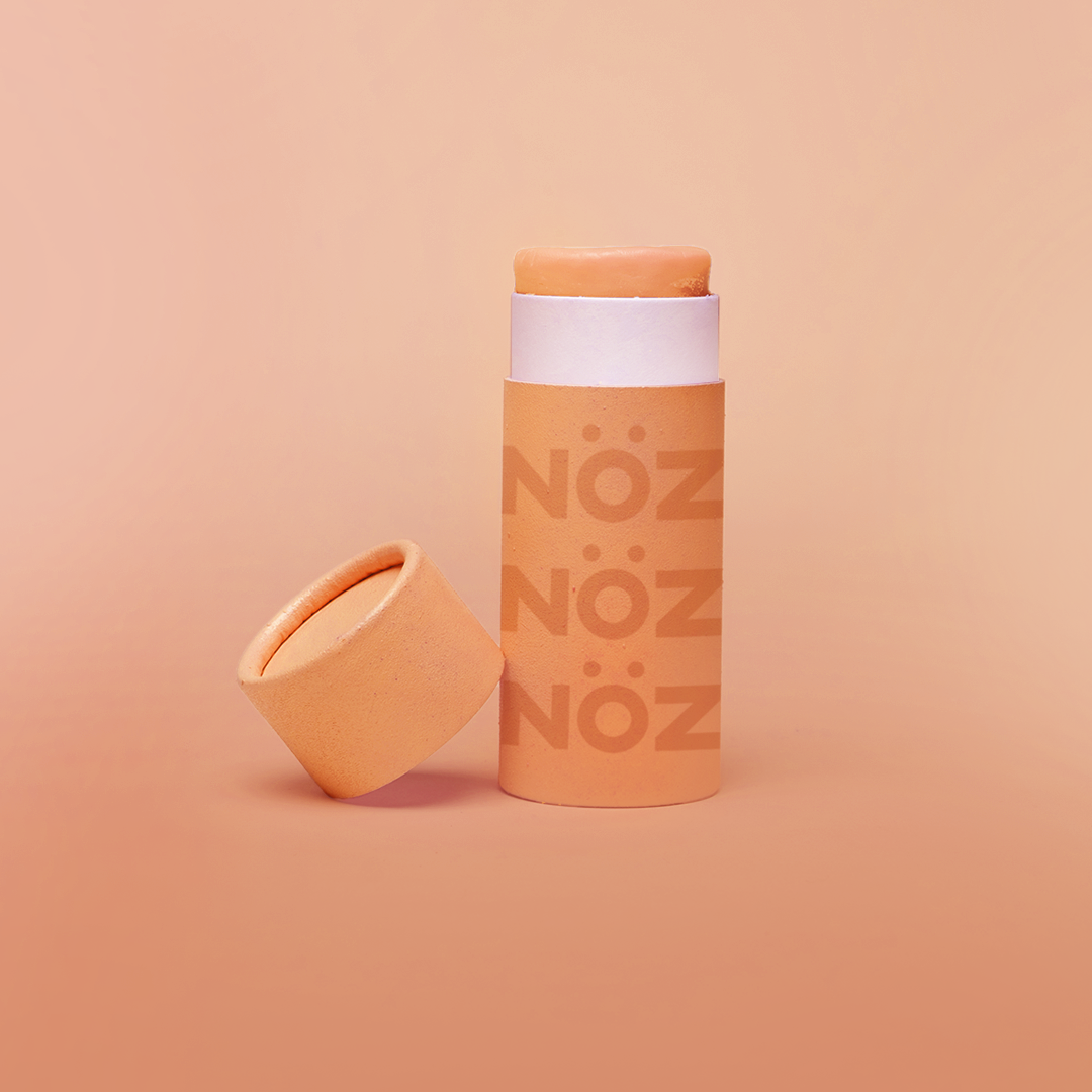 Full view of Nöz sunscreen stick in orange 