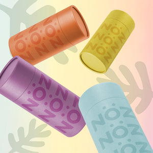 Four Nöz sunscreen sticks displaying the different colors available